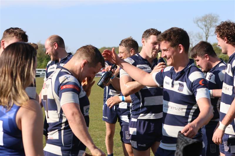 Club photo: post-match drinks and laughter in the sunshine